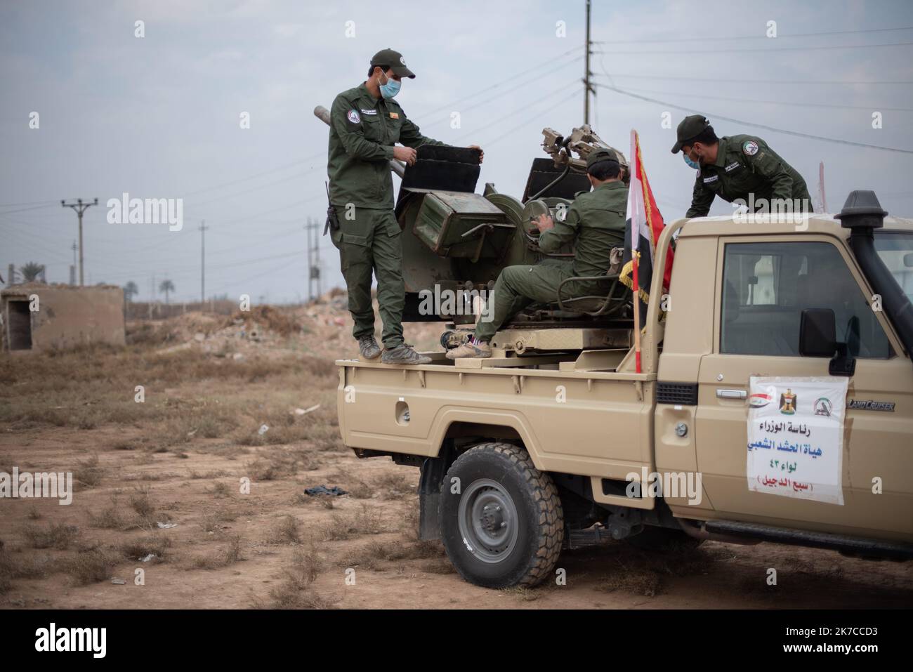 ©Chloe Sharrock / Le Pictorium/MAXPPP - Chloe Sharrock / Le Pictorium - 23/12/2020 - Irak / Samara - A une semaine de la commemoration de l'assassinat des leaders Iraniens Qassem Soleimani et Al-Mohandis, un entrainement est organise a` la base militaire de la Brigade 43 des Hachd al-Chaabi. La Brigade 43 est composee de paramilitaires du mouvement Asa'ib Ahl al-Haq. / 23/12/2020 - Iraq / Samara - A week before the commemoration of the killing of the two Iranian leaders Qassem Soleimani and Abu Mahdi al-Muhandis, a military training is organized in the military camp of the 43rd Brigade of the  Stock Photo